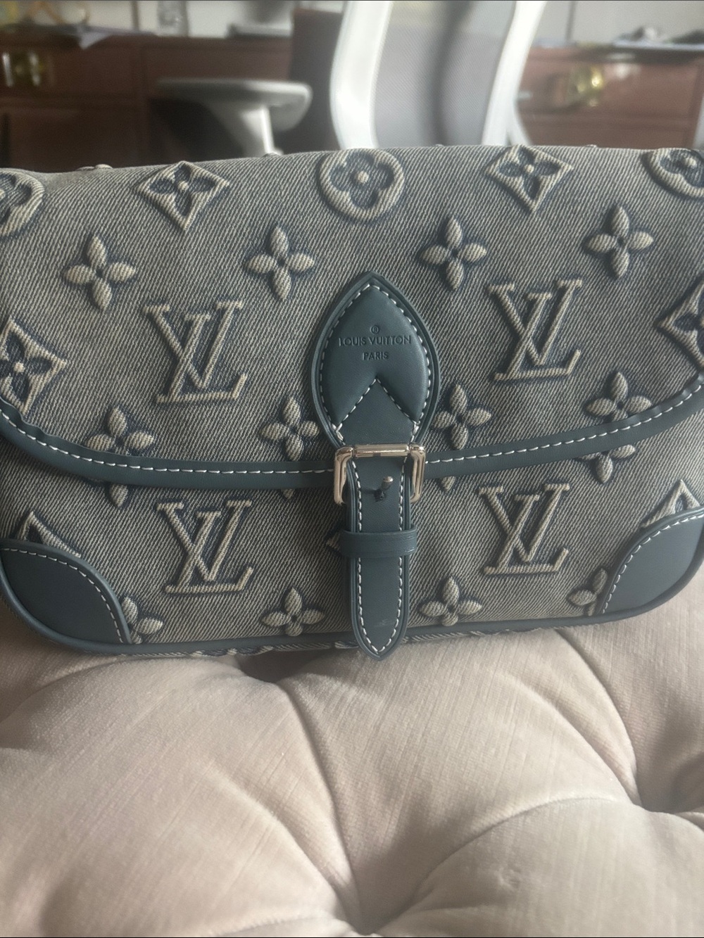 Denim bag with magnetic closure and outside pocket for Cell Phone.